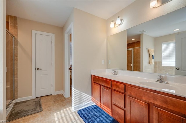 bathroom featuring vanity, tile patterned floors, and an enclosed shower