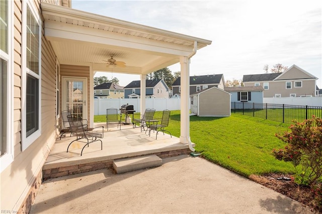 view of patio / terrace featuring ceiling fan and a storage unit