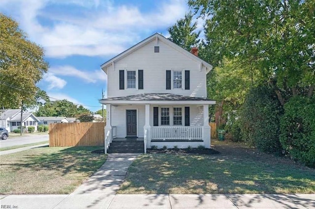 view of front property with a porch and a front lawn