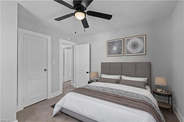 carpeted bedroom with ceiling fan