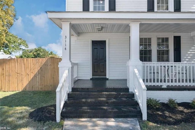 property entrance featuring covered porch