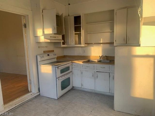 kitchen with sink and range with two ovens