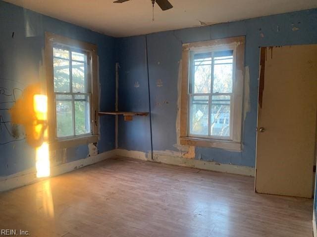 unfurnished room featuring ceiling fan and wood-type flooring