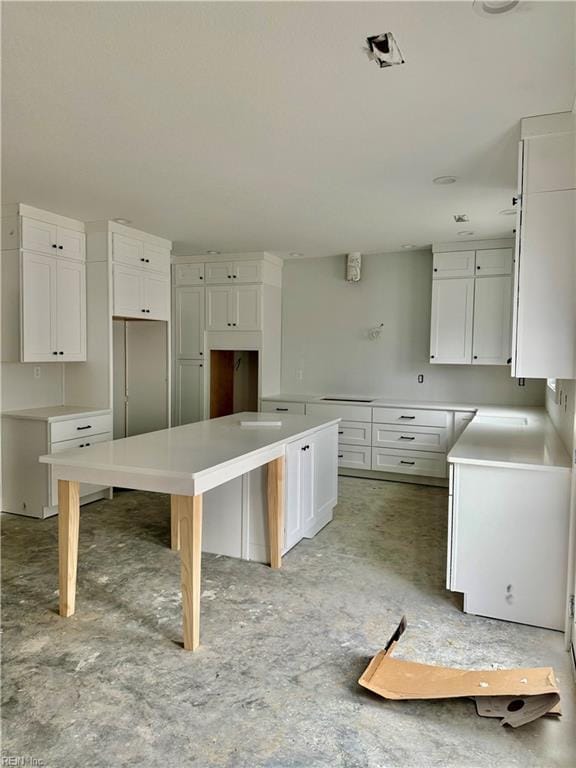 kitchen featuring white cabinetry and a kitchen island