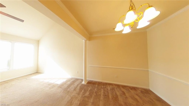 unfurnished room featuring carpet, ornamental molding, and a notable chandelier