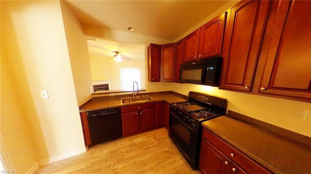 kitchen featuring black appliances, ceiling fan, sink, and light hardwood / wood-style flooring