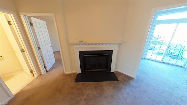 unfurnished living room with light carpet