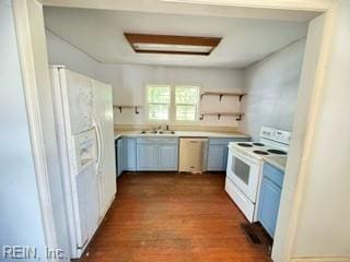 kitchen with sink, dark hardwood / wood-style floors, and white appliances