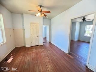 spare room with ceiling fan and dark hardwood / wood-style floors