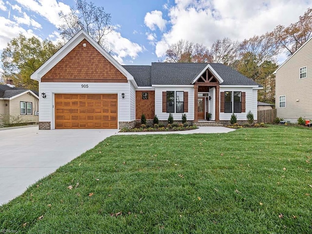 view of front of property featuring a garage and a front yard