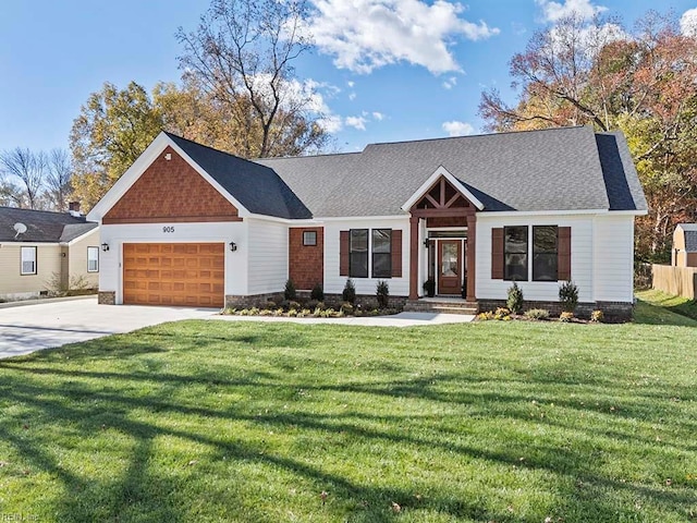 view of front of house featuring a garage and a front yard