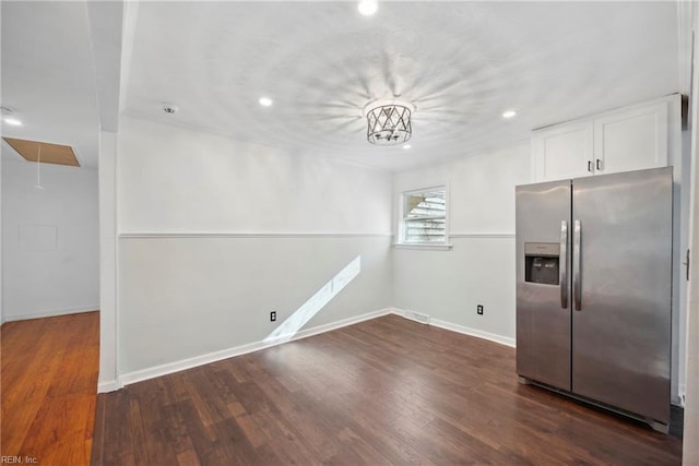 unfurnished dining area featuring dark wood-type flooring