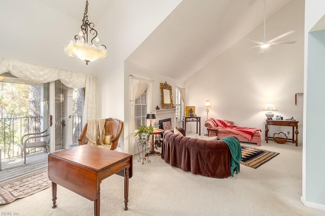 living room featuring carpet, ceiling fan, and high vaulted ceiling