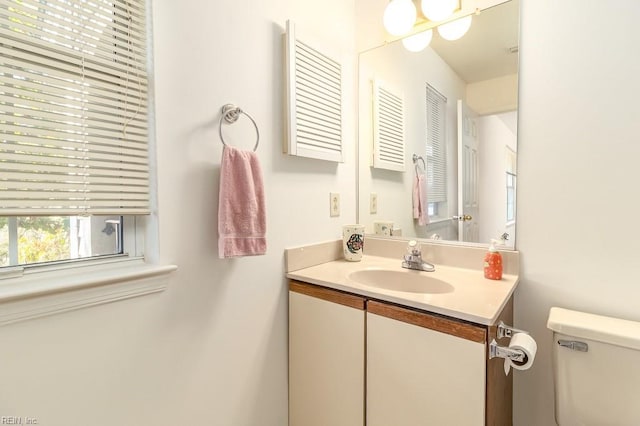 bathroom with vanity and toilet