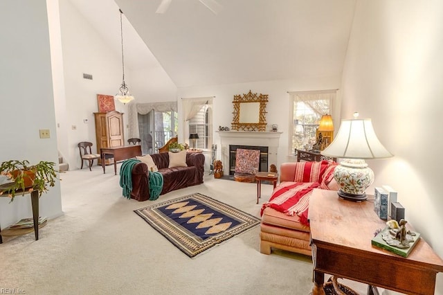 living room featuring carpet flooring, high vaulted ceiling, and a wealth of natural light