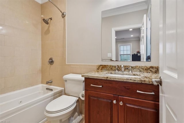 full bathroom with tiled shower / bath combo, toilet, ornamental molding, and vanity