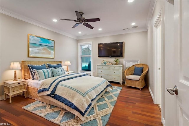 bedroom featuring ceiling fan, dark hardwood / wood-style flooring, and ornamental molding
