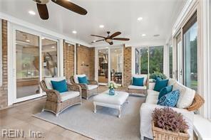 sunroom / solarium with ceiling fan