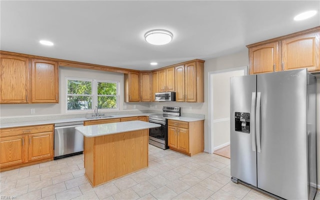 kitchen with a center island, stainless steel appliances, and sink