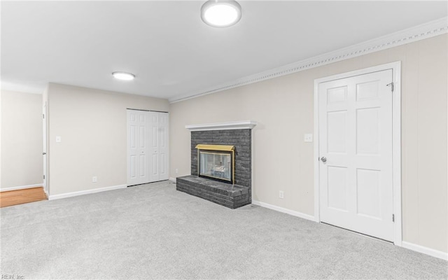 unfurnished living room featuring light colored carpet and a fireplace