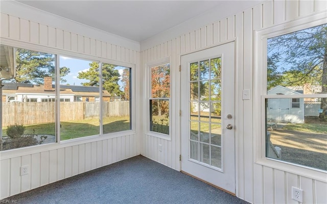 unfurnished sunroom with a healthy amount of sunlight