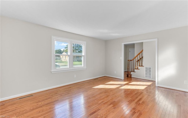 empty room with light hardwood / wood-style floors