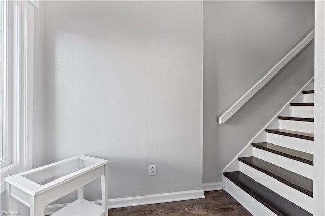 stairway featuring wood-type flooring