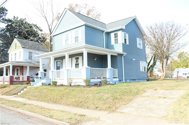 view of front of house featuring a front lawn and covered porch