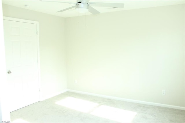 empty room with carpet and ceiling fan