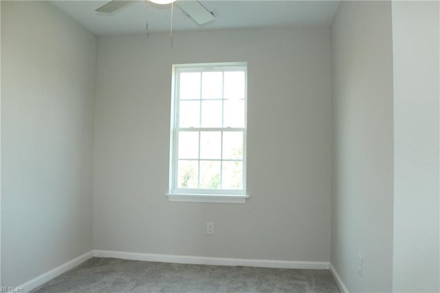 carpeted empty room with ceiling fan