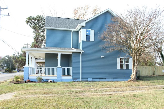 view of front of home featuring covered porch and a front yard