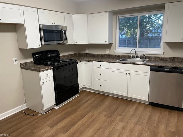 kitchen featuring white cabinets, sink, and appliances with stainless steel finishes