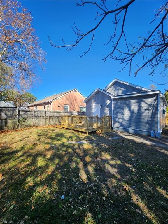 view of yard with a wooden deck