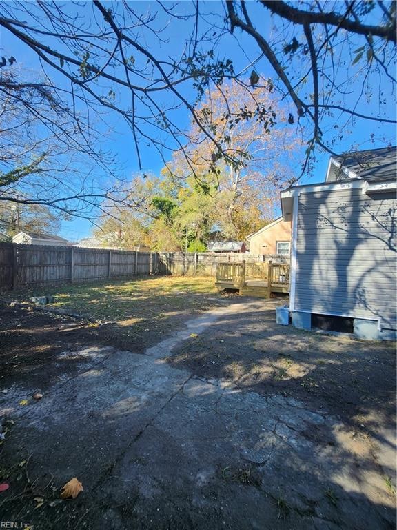 view of yard with a wooden deck