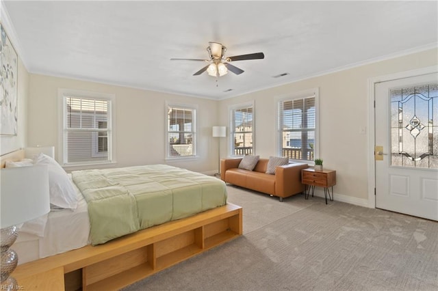 bedroom with multiple windows, ceiling fan, light carpet, and ornamental molding