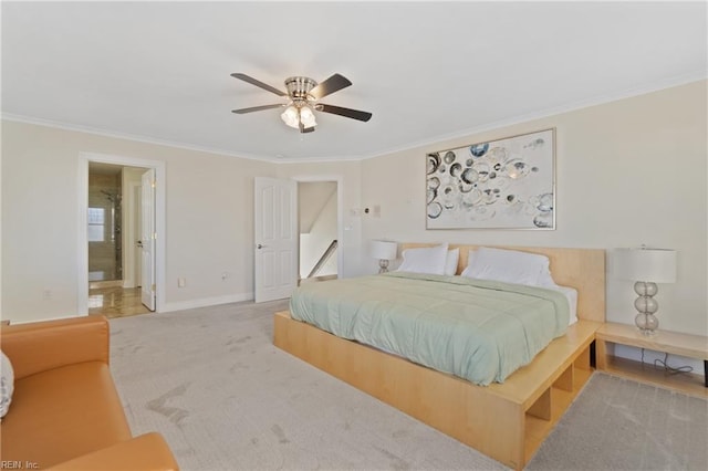 bedroom featuring connected bathroom, ceiling fan, carpet, and ornamental molding