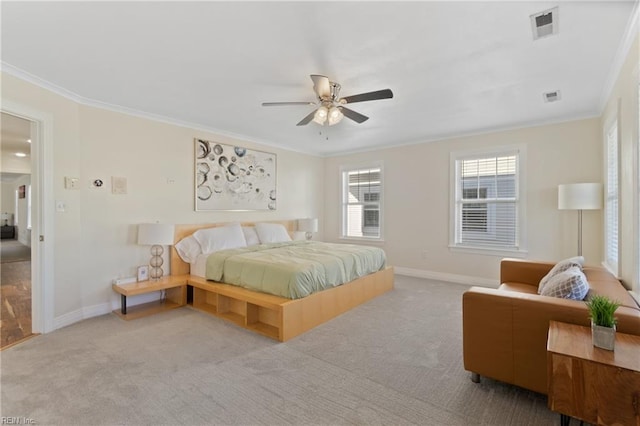 bedroom with ceiling fan, crown molding, and light colored carpet