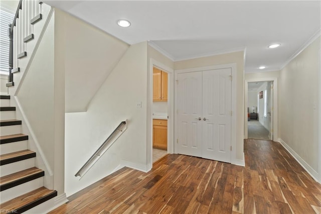 interior space featuring crown molding and hardwood / wood-style flooring