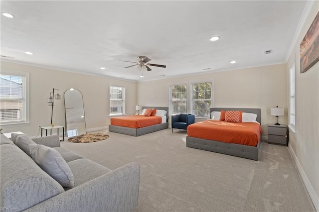 carpeted bedroom with ceiling fan, ornamental molding, and multiple windows