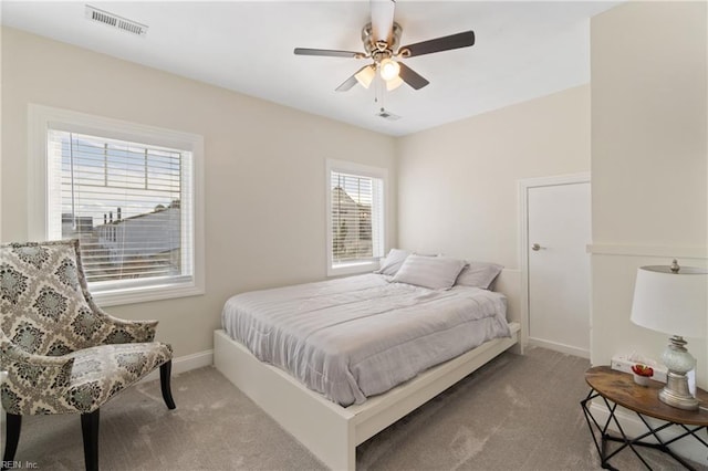 carpeted bedroom with ceiling fan