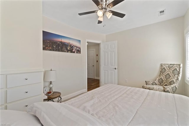 bedroom featuring hardwood / wood-style flooring and ceiling fan