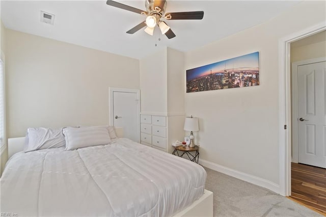 bedroom with ceiling fan and light wood-type flooring