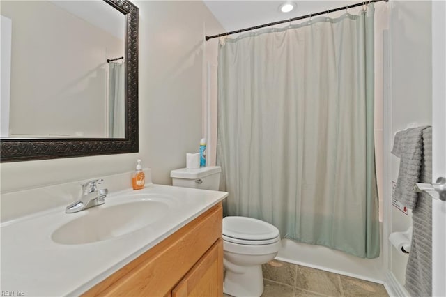 full bathroom with tile patterned floors, vanity, shower / bath combo, and toilet