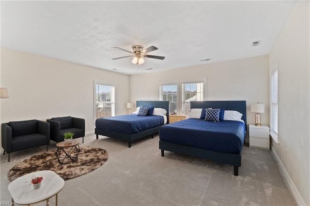 bedroom with light colored carpet and ceiling fan