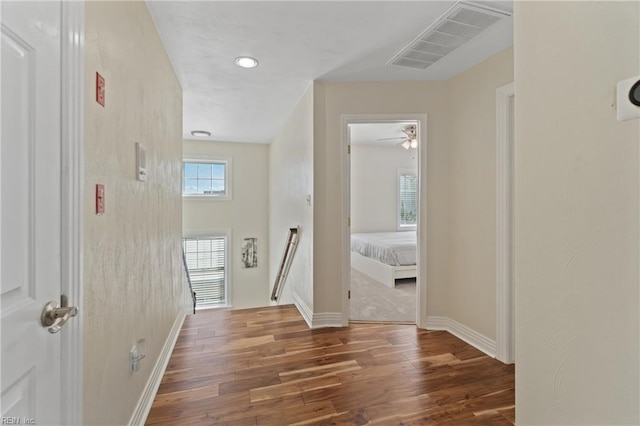 corridor with dark wood-type flooring