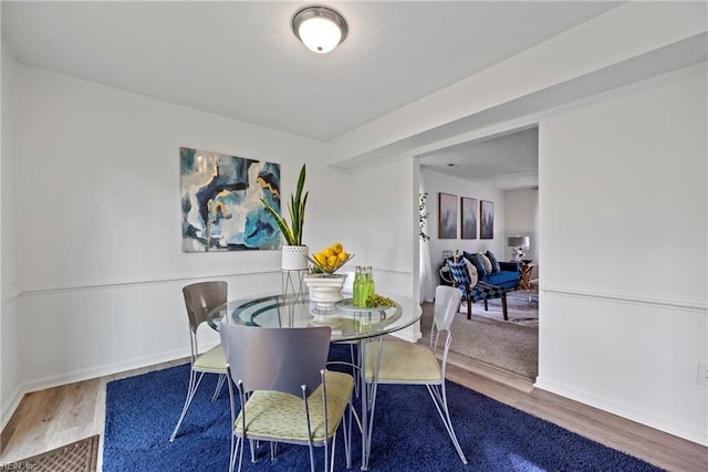 dining room with wood-type flooring