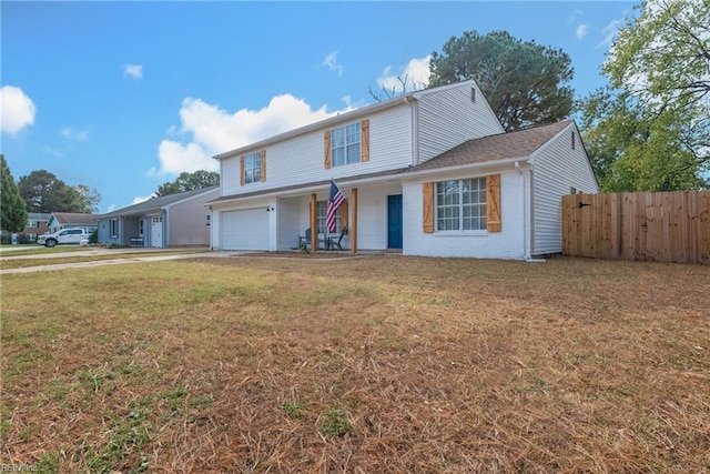 view of front property with a front yard and a garage