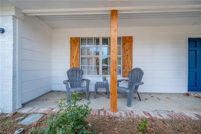 view of patio featuring a porch