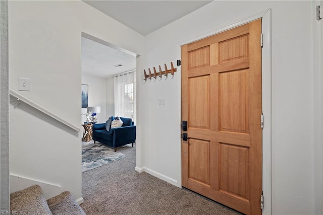 view of carpeted entrance foyer