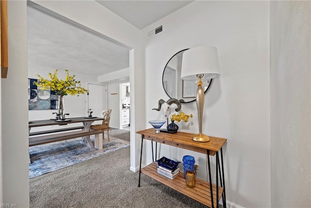 hallway featuring carpet floors